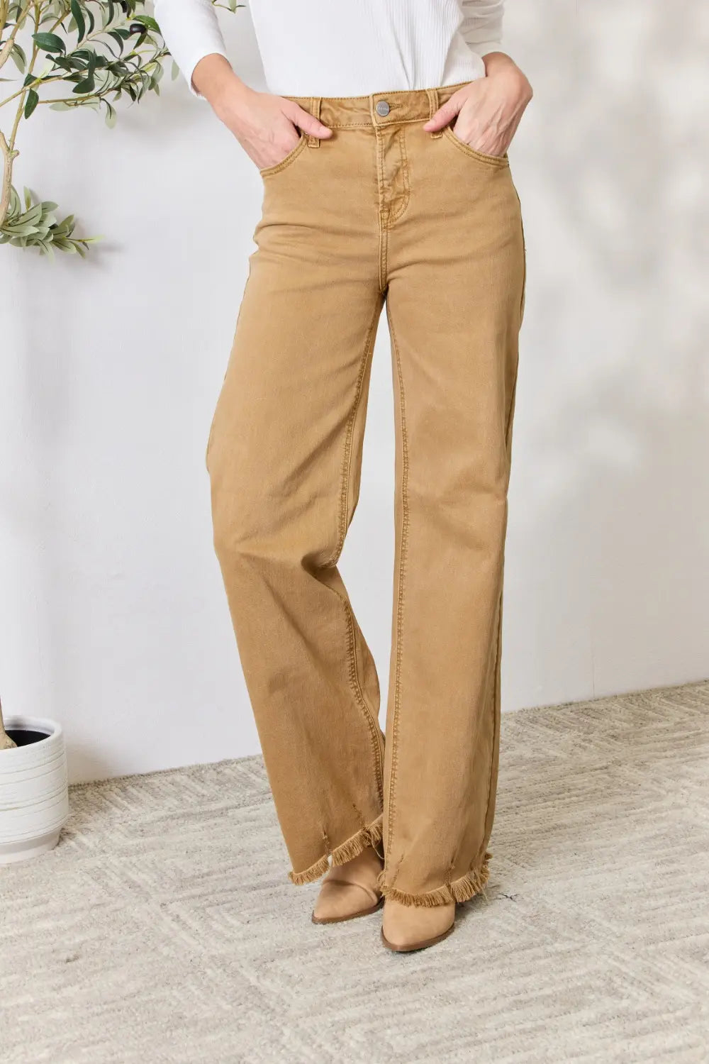 Risen full size fringe hem wide leg jeans from Trendsi, featuring a relaxed fit with distressed details and wide-leg silhouette.