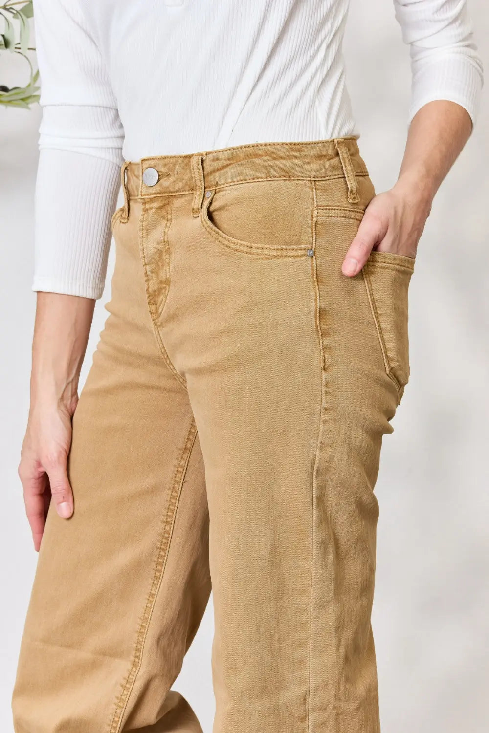 Risen full size fringe hem wide-leg jeans from Trendsi, featuring a relaxed fit and stylish distressed details.