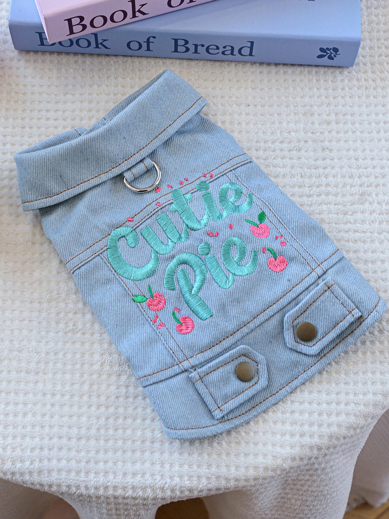 Small embroidered denim pet jacket with floral details, designed for pets, from Trendsi's Mom's Best Friend collection.