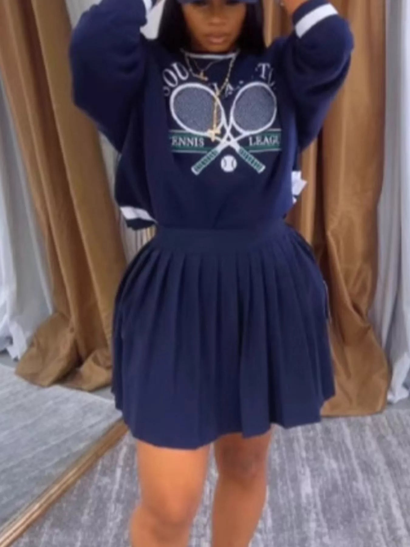 Navy blue sweatshirt and skirt set by Trendsi, featuring a stylish, casual look for effortless chic fashion.