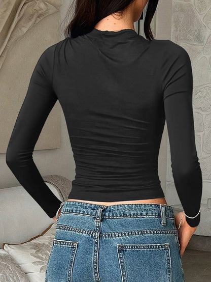 Navy blue fitted long sleeve T-shirt from Trendsi, stylish and comfortable, shown on a model with a casual fit.
