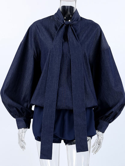 Navy tie-front denim top and matching shorts set by Trendsi, styled with casual accessories and rolled hems for a relaxed look.