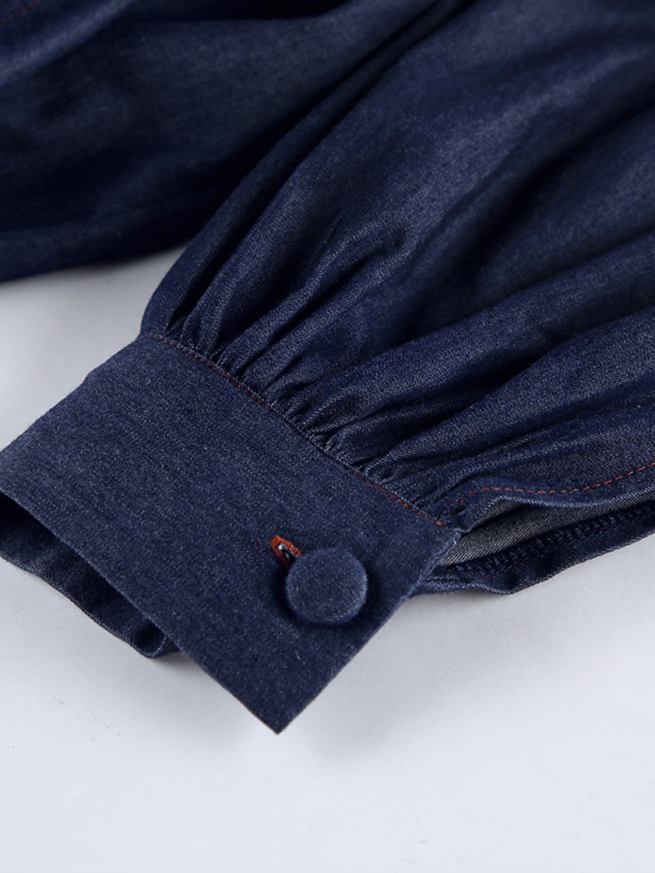 Navy tie-front denim top and shorts set by Trendsi, featuring a casual, stylish summer outfit with button details and rolled hems.