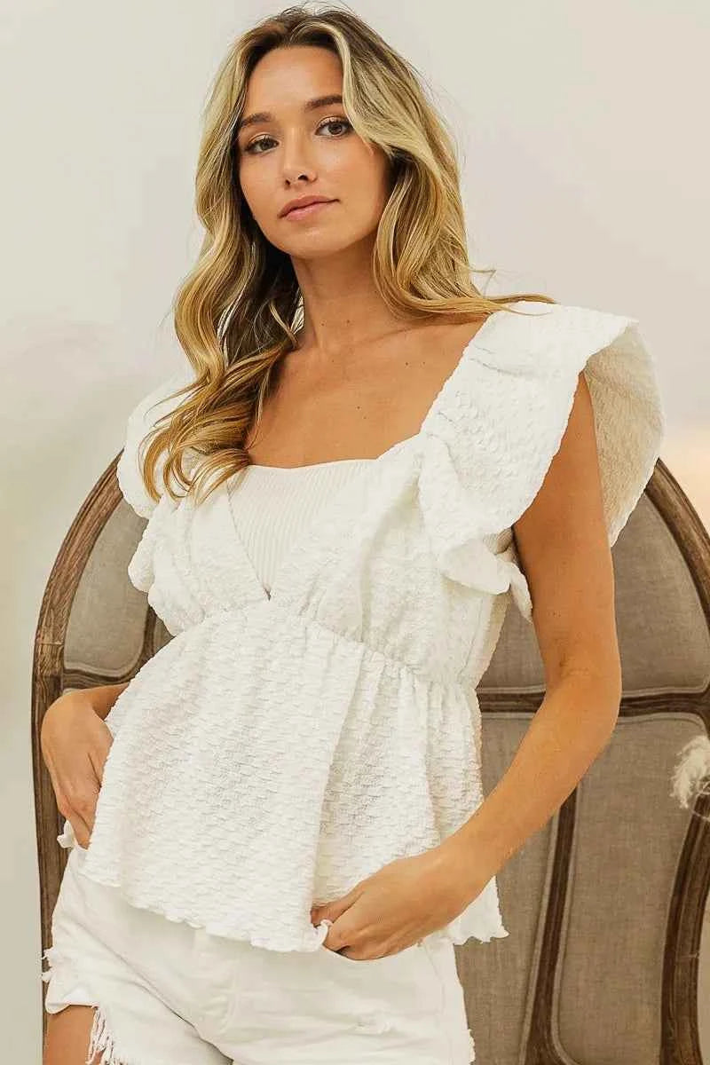 BiBi Crinkle Bubble Textured Ruffled Top in trendy fabric, featuring ruffle details and a unique crinkle bubble texture.