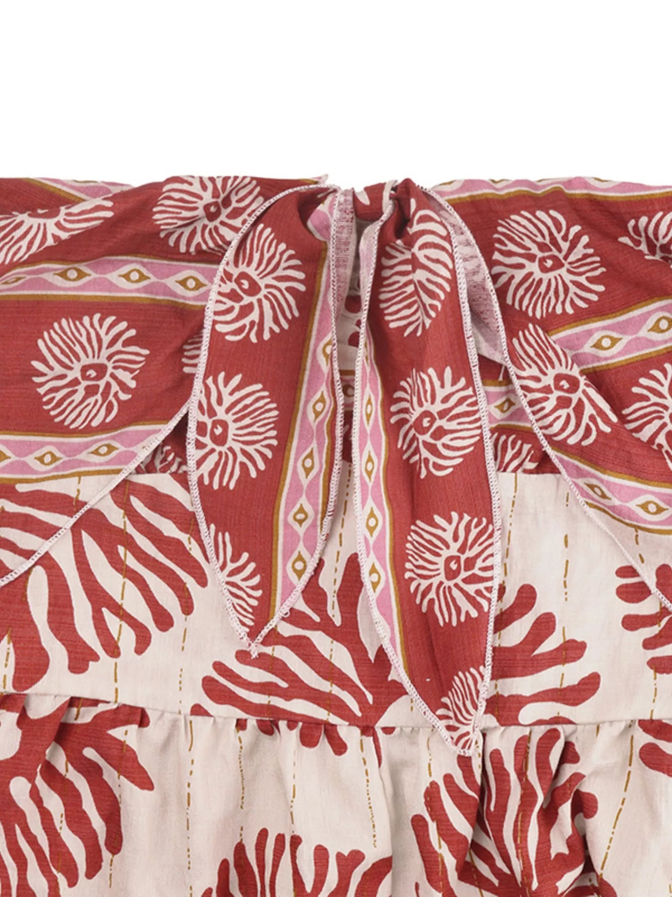 Trendsi floral print strapless wide-leg jumpsuit in mahogany color, featuring a stylish one-piece design and flowing wide-leg pants.