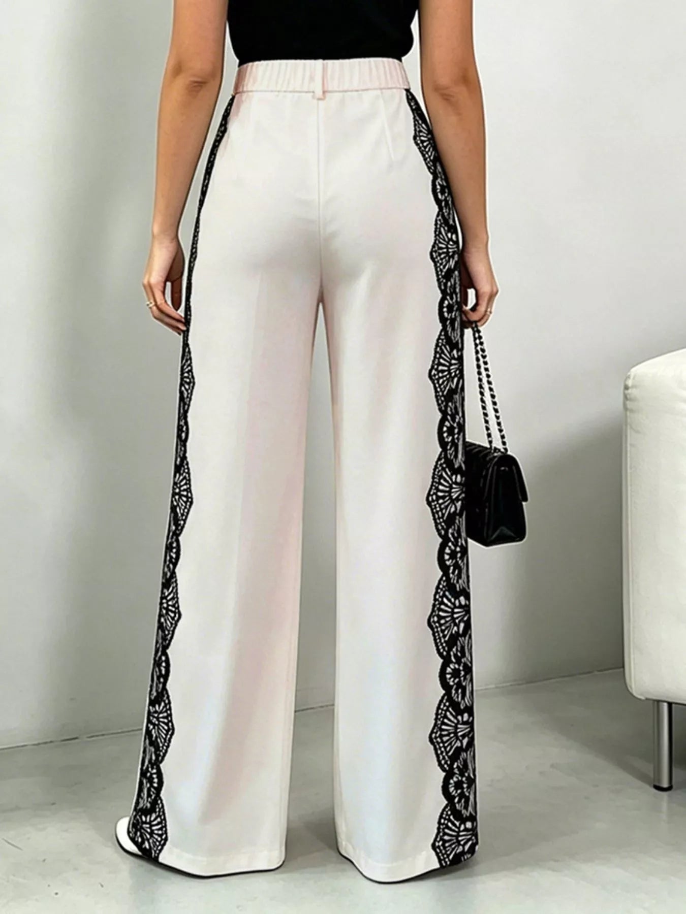 Beige lace detail wide-leg pants from Trendsi, featuring flowing fabric and elegant design for a chic look.