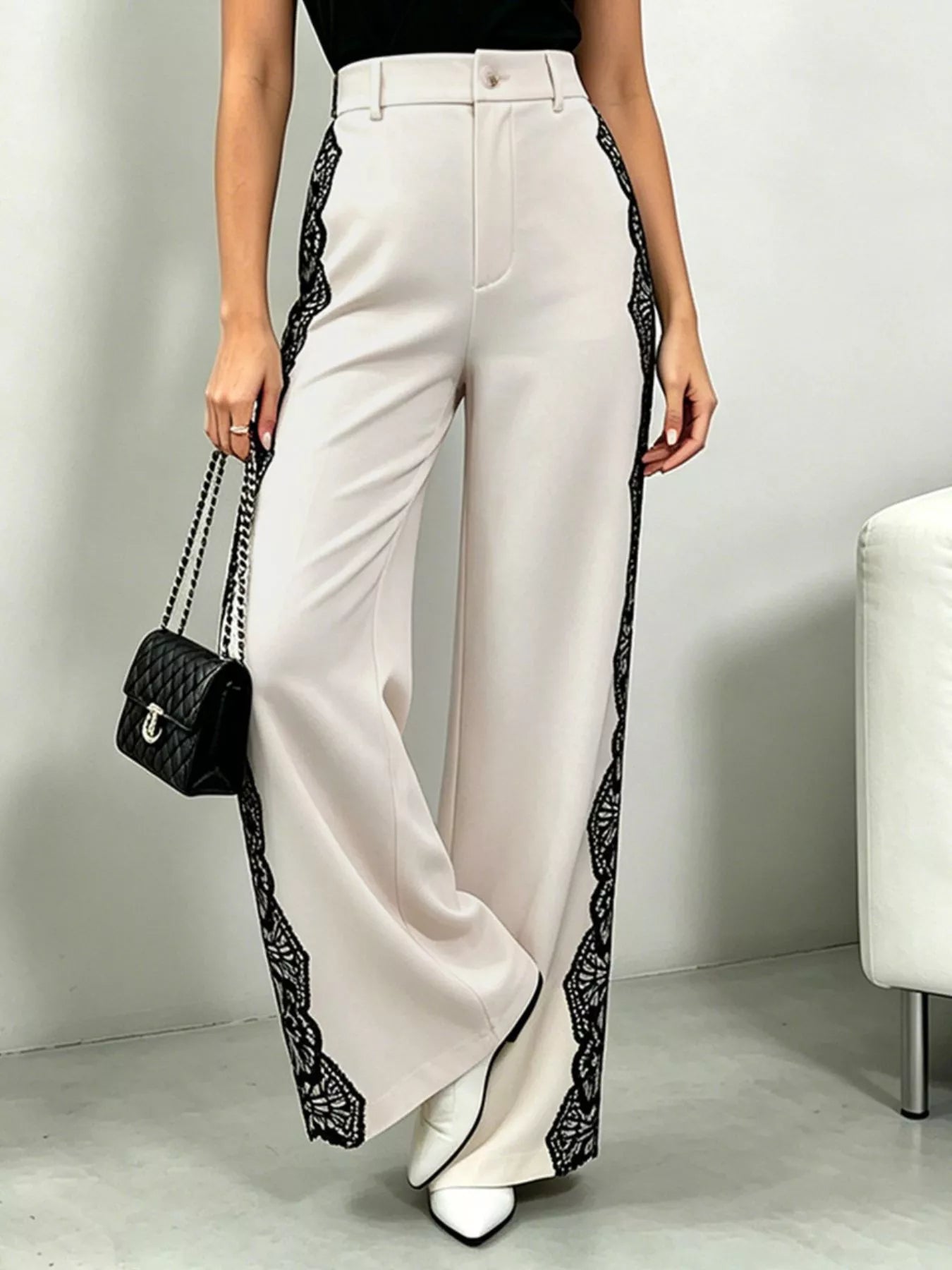 Beige lace-detail wide-leg pants by Trendsi, featuring flowing fabric and stylish design, perfect for casual or dressy wear.