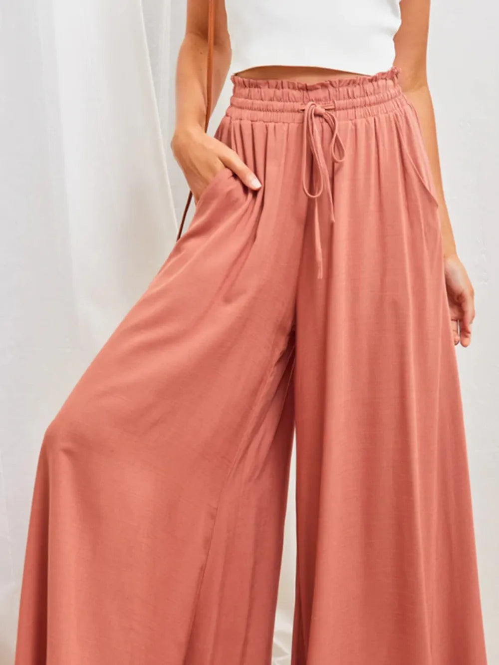 Coral high waist wide-leg pants from Trendsi, featuring a relaxed fit and stylish design, perfect for casual or chic outfits.