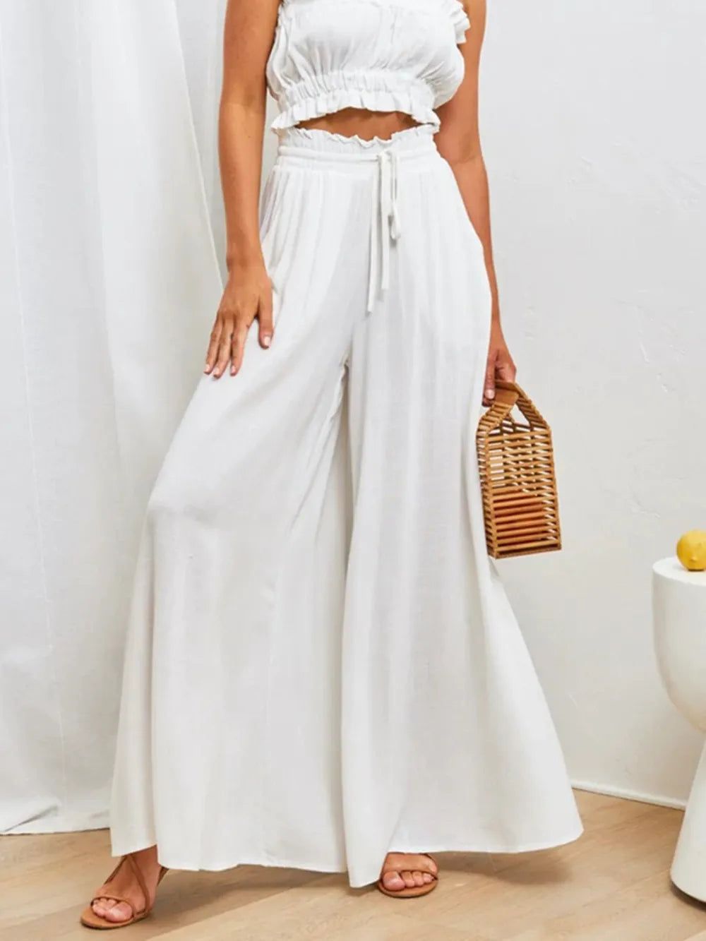 Coral high waist wide-leg pants by Trendsi, featuring a relaxed fit and flowing fabric, perfect for casual or stylish outfits.