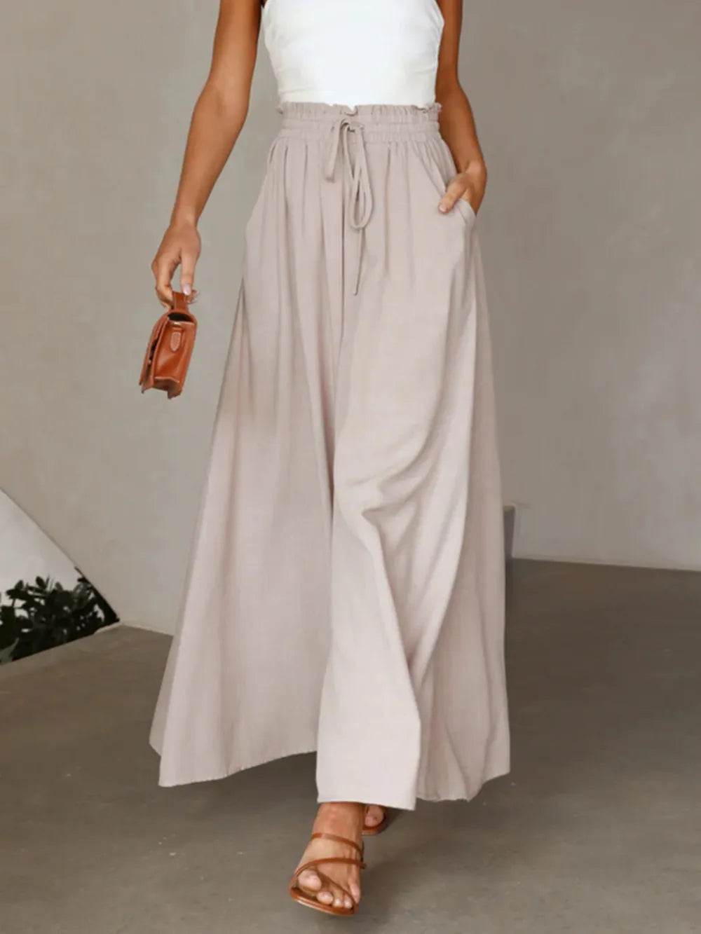 Coral high waist wide leg pants by Trendsi, shown on a mannequin, featuring a relaxed fit and fashionable silhouette.
