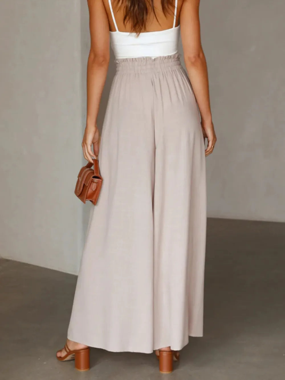 Coral high waist wide leg pants from Trendsi, showing the flowy, relaxed fit and tailored waistband in a stylish fashion shot.