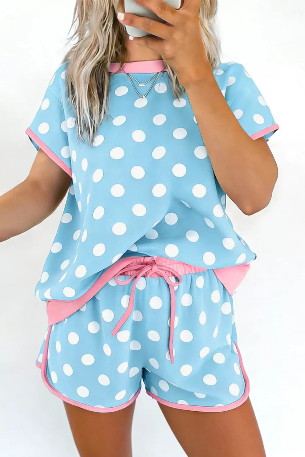 Pastel blue polka dot contrast trim top and drawstring shorts set by Trendsi, casual summer loungewear ensemble.