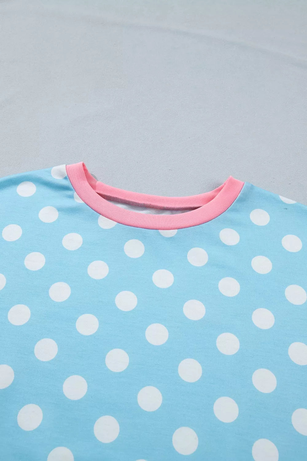 Pastel blue polka dot contrast trim top and drawstring shorts set by Trendsi, casual summer outfit with playful design.