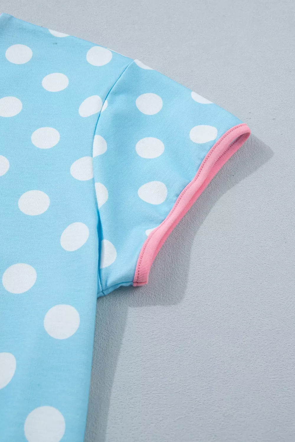 Pastel blue polka dot contrast trim top and drawstring shorts set by Trendsi, casual summer outfit with playful pattern and comfortable fit.