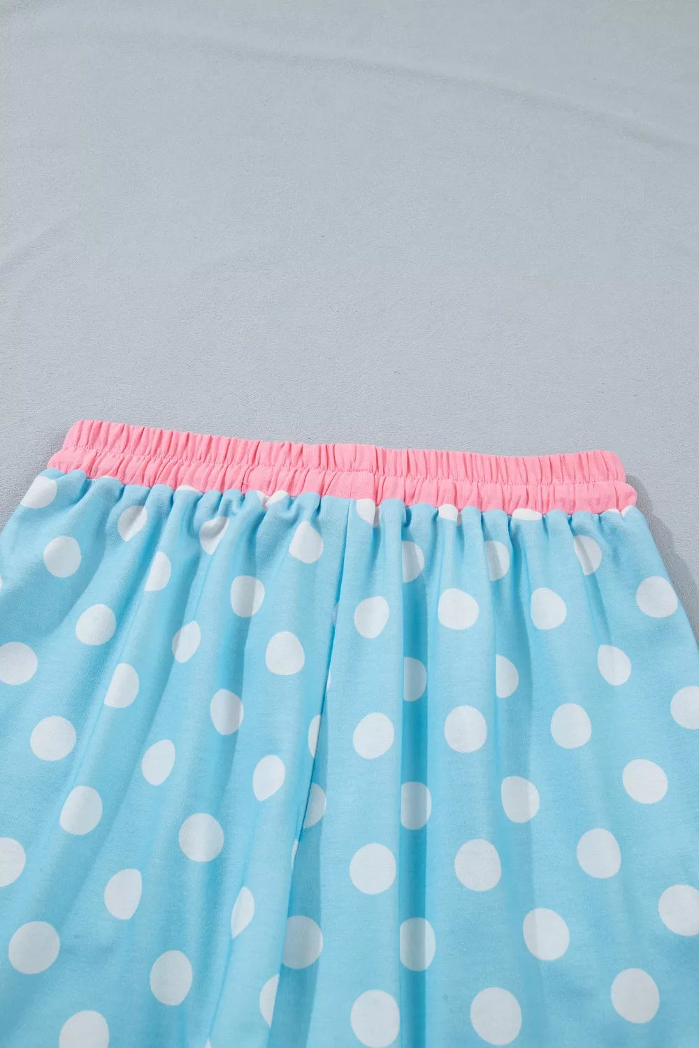 Pastel blue polka dot contrast trim top and drawstring shorts set by Trendsi, casual and stylish summer outfit.
