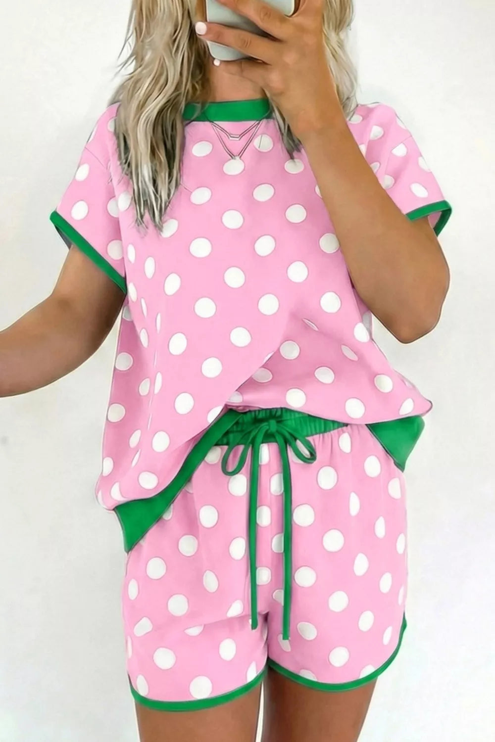 Pastel blue polka dot contrast trim top and drawstring shorts set by Trendsi, casual loungewear with playful pattern and comfortable fit.