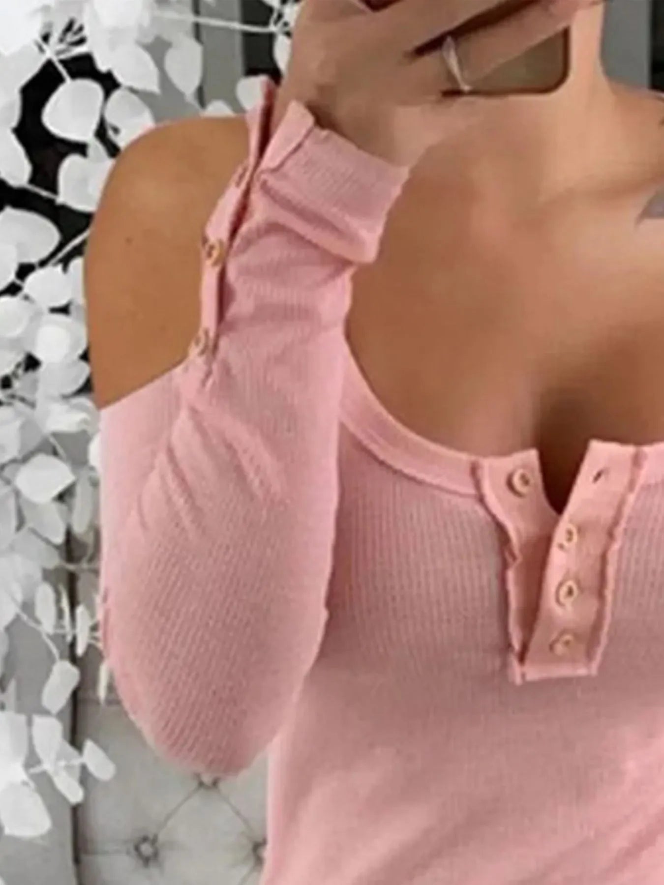 Pink cold shoulder ribbed Henley T-shirt with button detail, casual women's top by Trendsi, shown on a hanger.