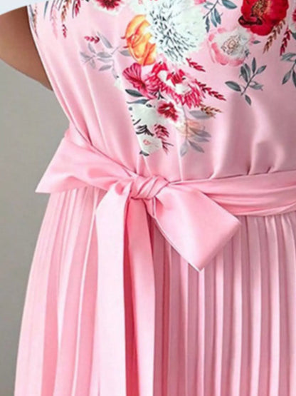 Pink halter neck floral print pleated maxi dress by Trendsi, featuring a flowing silhouette and elegant design.