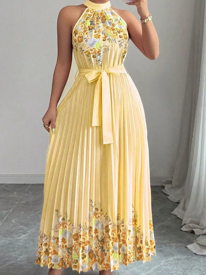 Pink halter neck floral print pleated maxi dress by Trendsi, flowing fabric with a stylish, elegant design.