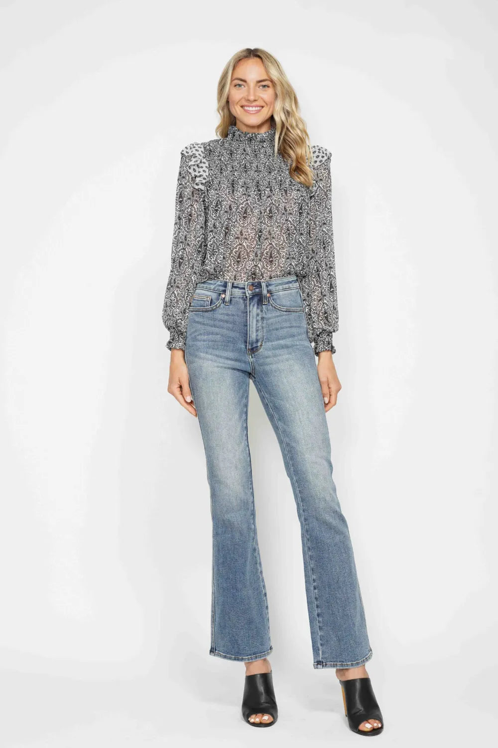 Plus size Judy Blue bootcut jeans with tummy control, embroidered back pockets, and classic pocket design, full-length denim style.