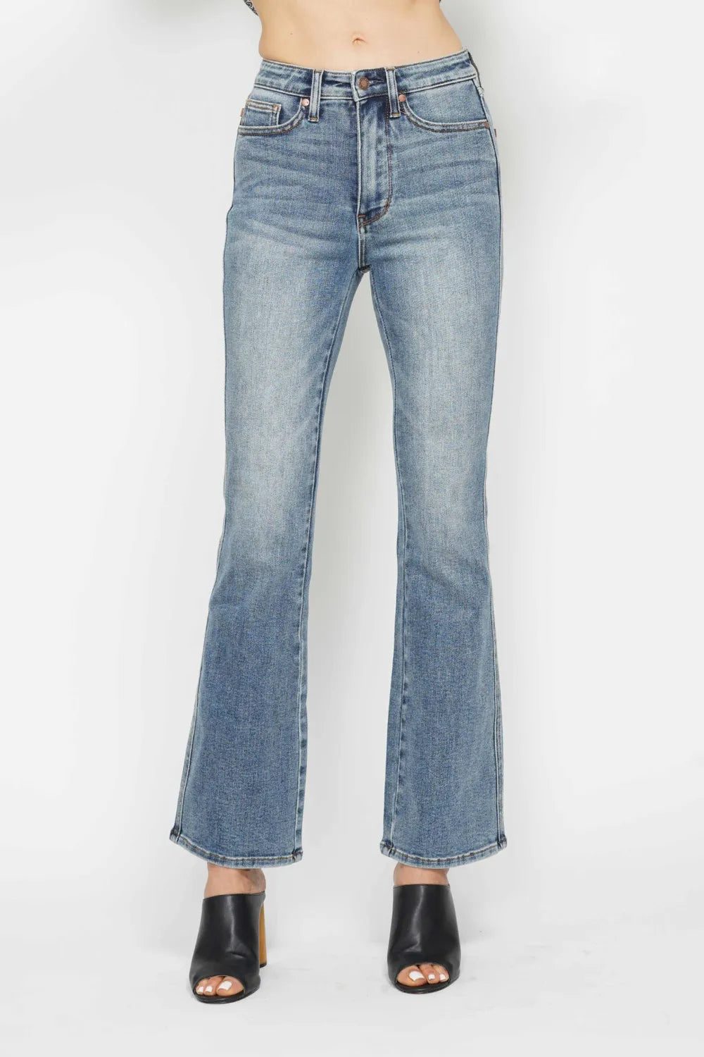 Plus size Judy Blue tummy control bootcut jeans with back embroidered pockets and classic denim look.