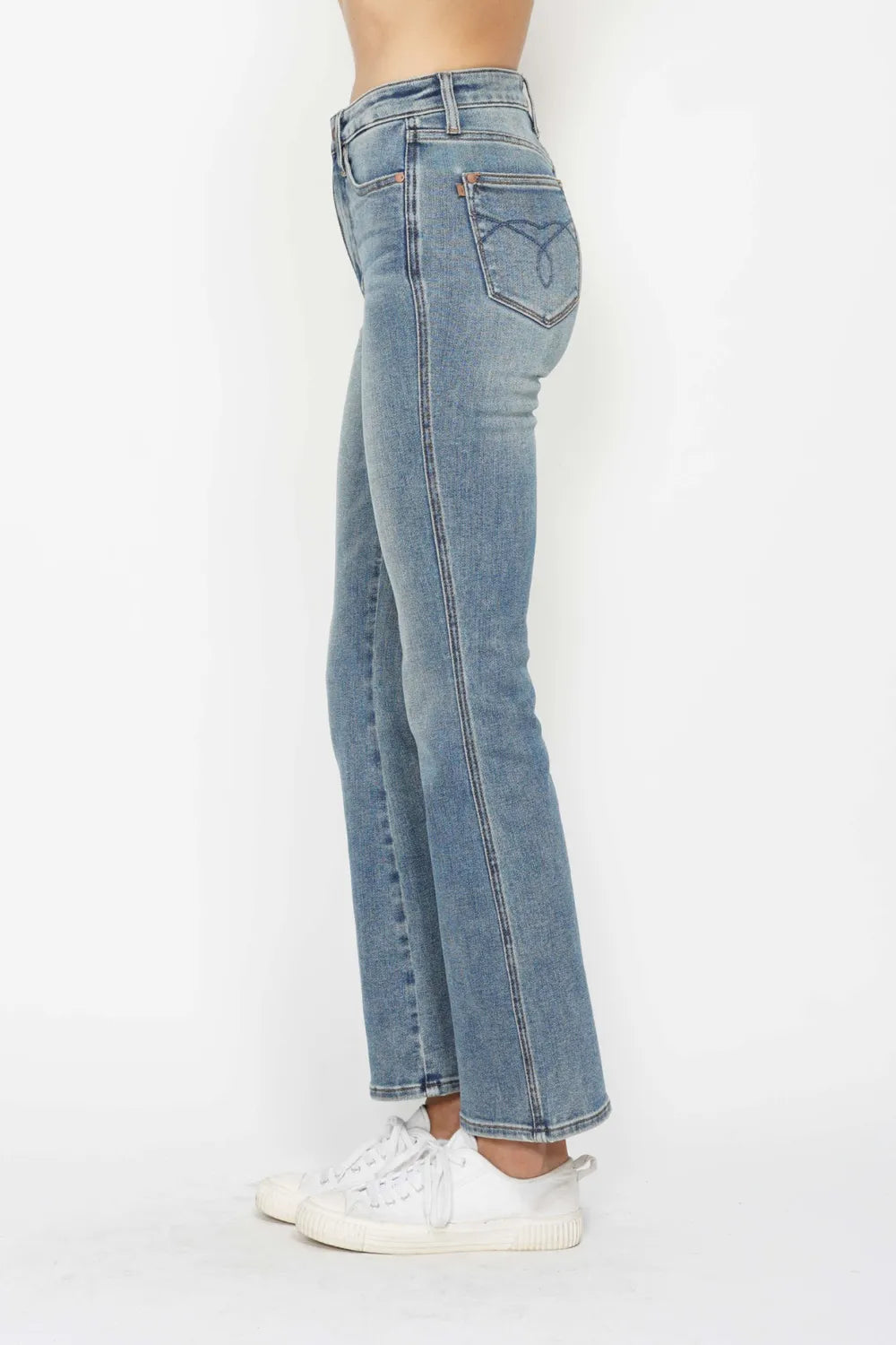Plus size Judy Blue bootcut jeans with tummy control, embroidered pockets, and back pockets, designed for a comfortable fit.