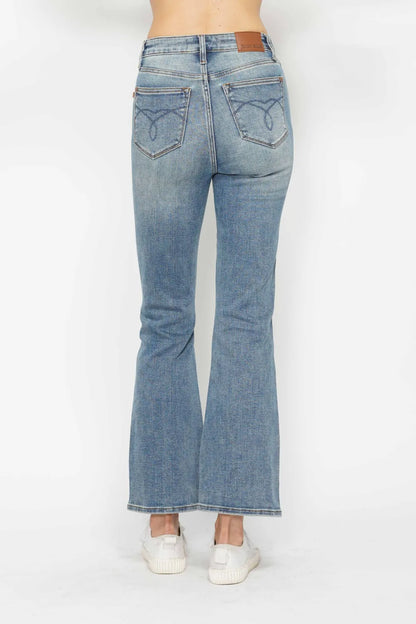 Plus size Judy Blue bootcut jeans with tummy control, embroidered pockets, and back pockets, designed for a comfortable fit.