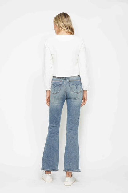 Plus size Judy Blue bootcut jeans with tummy control, embroidered back pockets, and classic pocket details for a flattering fit.