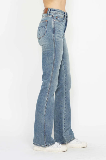 Plus size Judy Blue bootcut jeans with tummy control, embroidered pockets, and back pockets, designed for a comfortable fit.