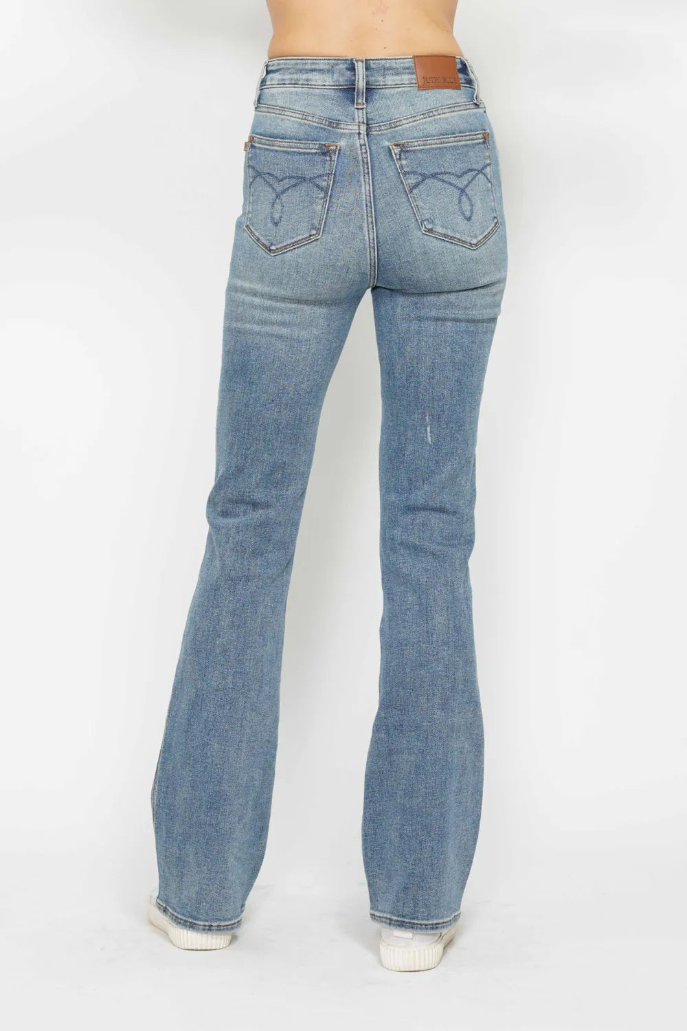 Plus size Judy Blue tummy control bootcut jeans with embroidered back pockets and classic five-pocket design.