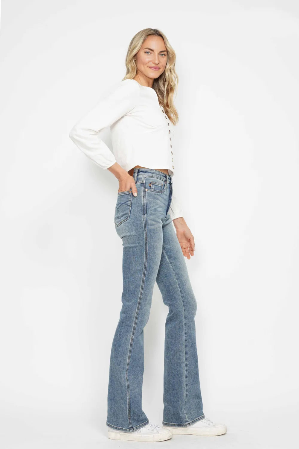 Full size Judy Blue tummy control bootcut jeans with embroidered back pockets and plus size fit, displayed on a model.
