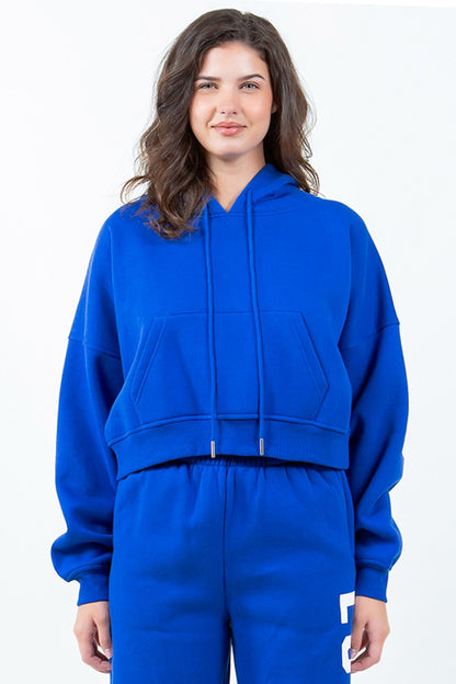 Royal blue cropped hoodie with bold letter graphic, stylish casual hoodie from Trendsi for effortless chic and comfortable everyday wear.