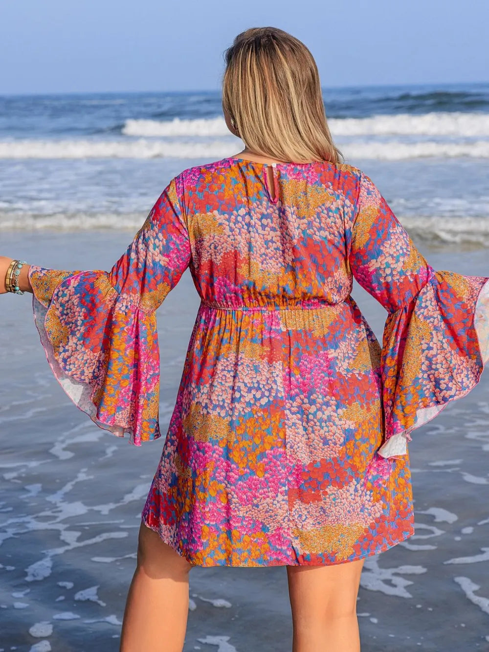 Plus size red ruched long sleeve dress by Trendsi, featuring a chic and elegant design with a flattering fit.