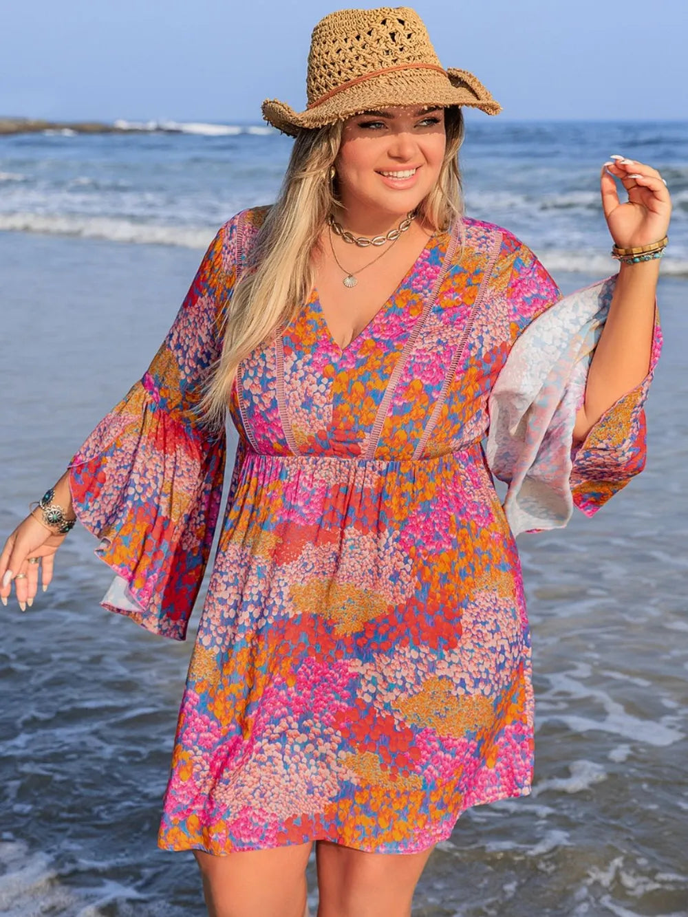 Plus size ruched long sleeve dress by Trendsi featuring a chic, elegant design with a flattering fit and stylish details.