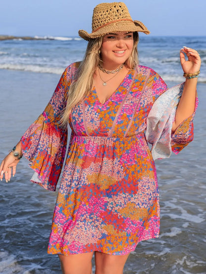 Plus size ruched long sleeve dress by Trendsi featuring a chic, elegant design with a flattering fit and stylish details.