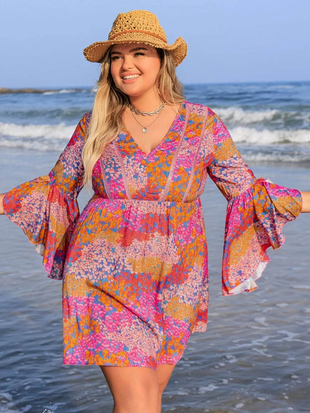 Plus size scarlet long sleeve ruched dress by Trendsi, featuring elegant and comfortable design for sophisticated style.