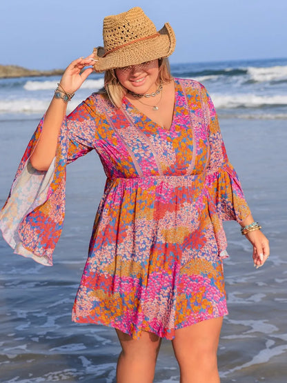 Plus size ruched long sleeve dress by Trendsi, featuring a chic, elegant design with a flattering fit and stylish details.