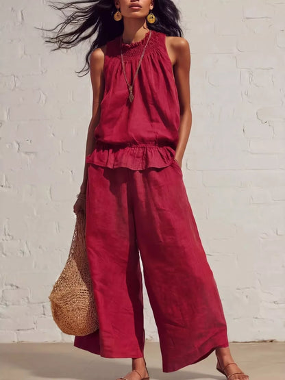 Smocked ruffled hem top and wide-leg pants set from Trendsi, featuring a stylish, coordinated outfit with ruffle details and comfortable fit.