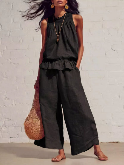 Smocked ruffled hem top and wide-leg pants set by Trendsi, featuring a stylish, coordinated fashion look with soft fabric and trendy design.