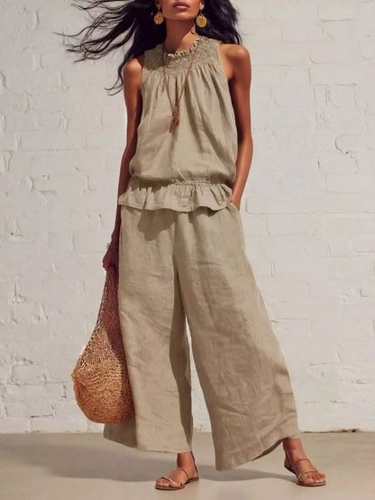Trendsi smocked ruffled hem top and wide-leg pants set, featuring a stylish, coordinated outfit with ruffles and a relaxed fit.