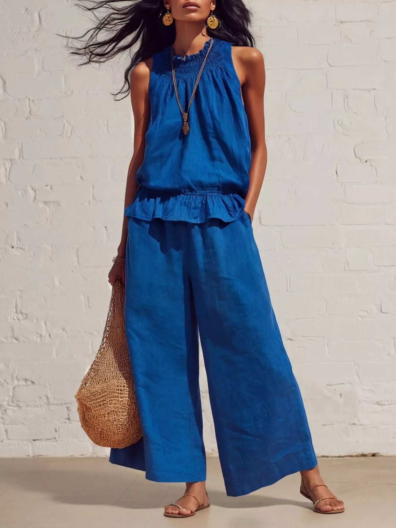 Trendsi smocked ruffled hem top with wide-leg pants set, featuring flowy fabric and stylish design, shown on a model.