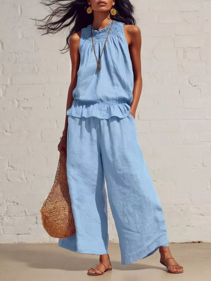 Smocked ruffled hem top and wide-leg pants set by Trendsi, featuring a stylish, coordinated outfit with ruffle details and comfortable fit.