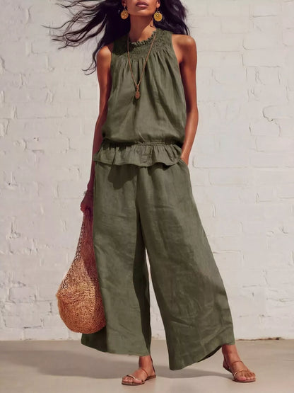 Smocked ruffled hem top and wide-leg pants set by Trendsi, featuring stylish, comfortable clothing with a chic, modern design.