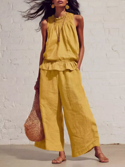 Smocked ruffled hem top and wide-leg pants set by Trendsi, featuring a stylish, coordinated outfit with soft fabric and trendy design.