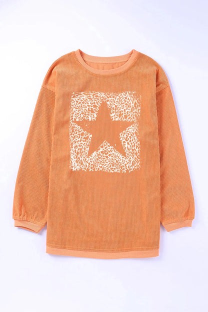 Oversized star sweatshirt by Trendsi in sherbet color, featuring a cozy fit and casual style perfect for everyday wear.