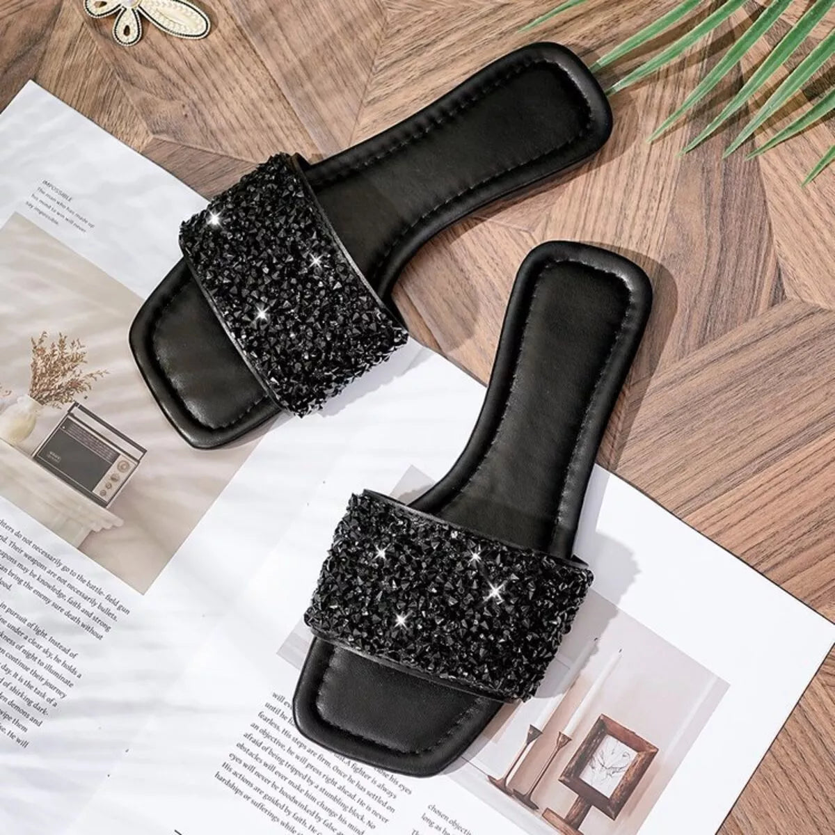 Black Trendsi rhinestone open toe sandals showing stylish straps and sparkling rhinestone embellishments on a pair of women's shoes.
