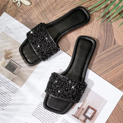 Black Trendsi rhinestone open toe sandals showing stylish straps and sparkling rhinestone embellishments on a pair of women's shoes.