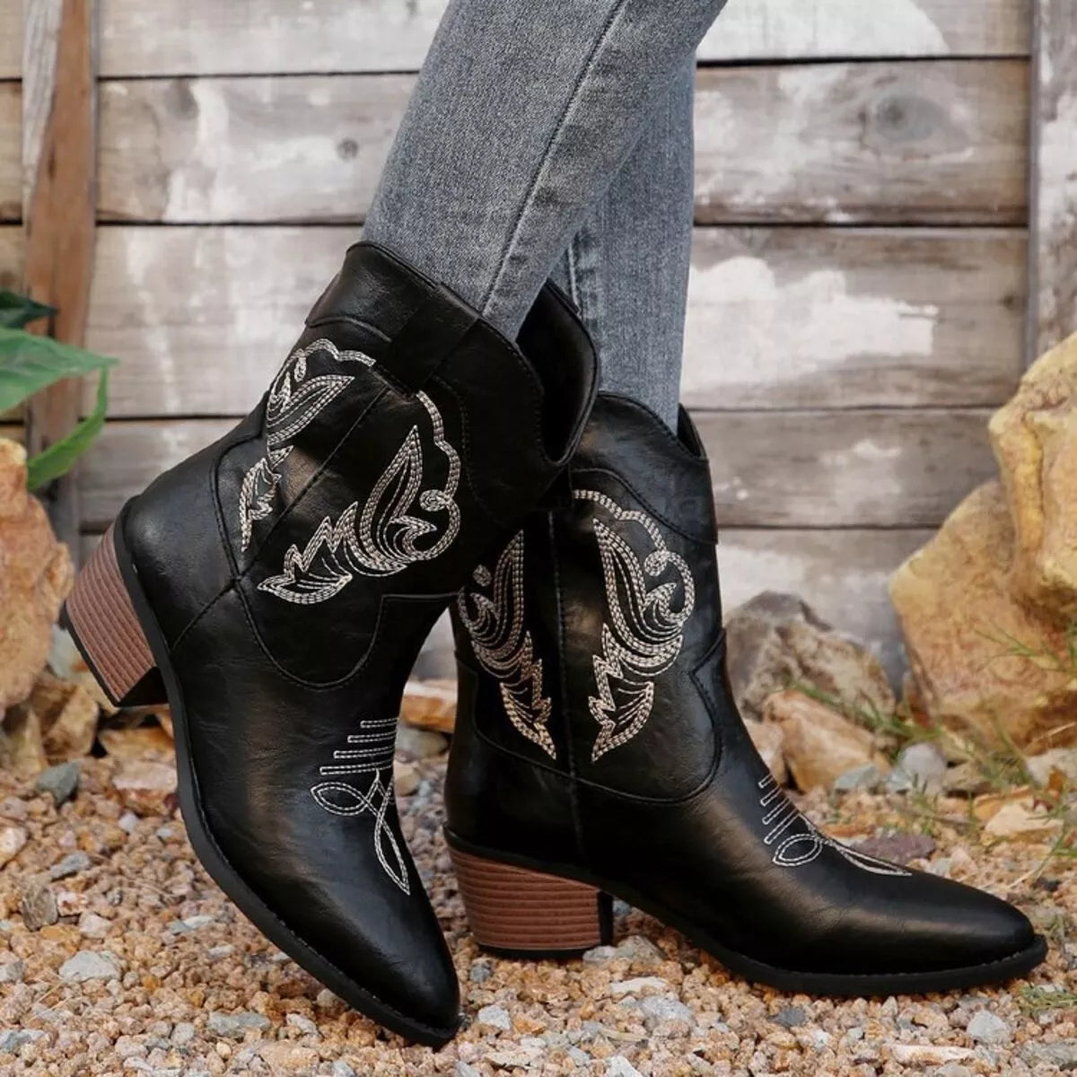Black Western cowboy boots with embroidered design from Trendsi, featuring classic Western shoe style and detailed needlework.