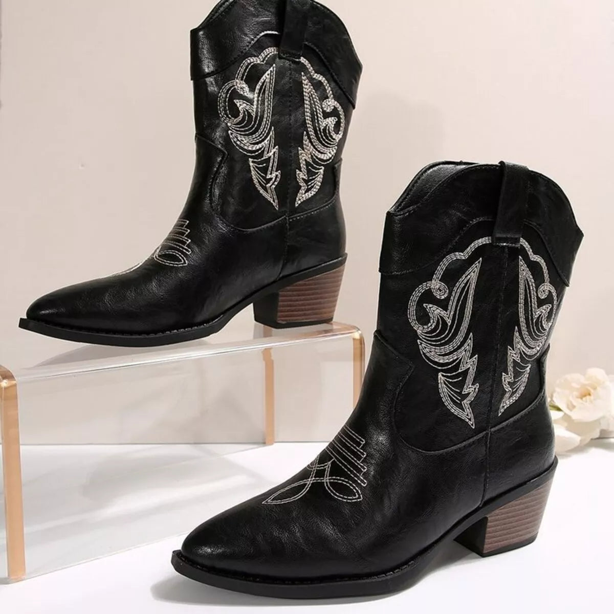 Black Western cowboy boots with embroidered design, trendy shoes by Trendsi, showcasing detailed stitching and classic Western style.