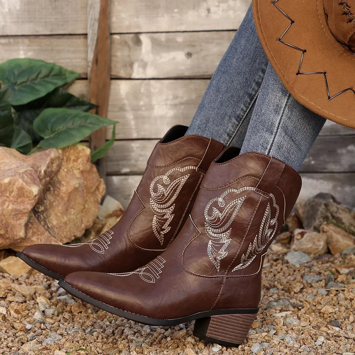 Black Western cowboy boots with embroidered design from Trendsi, showcasing detailed stitching and classic Western shoe style.
